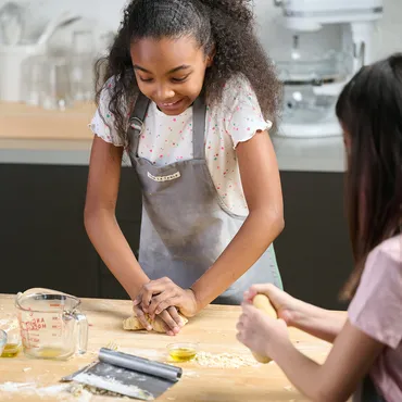 teen boy and girl steaming dumplings in Sur La Table kitchen