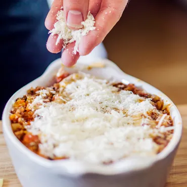 Mini Baked Lasagnas topped with cheese
